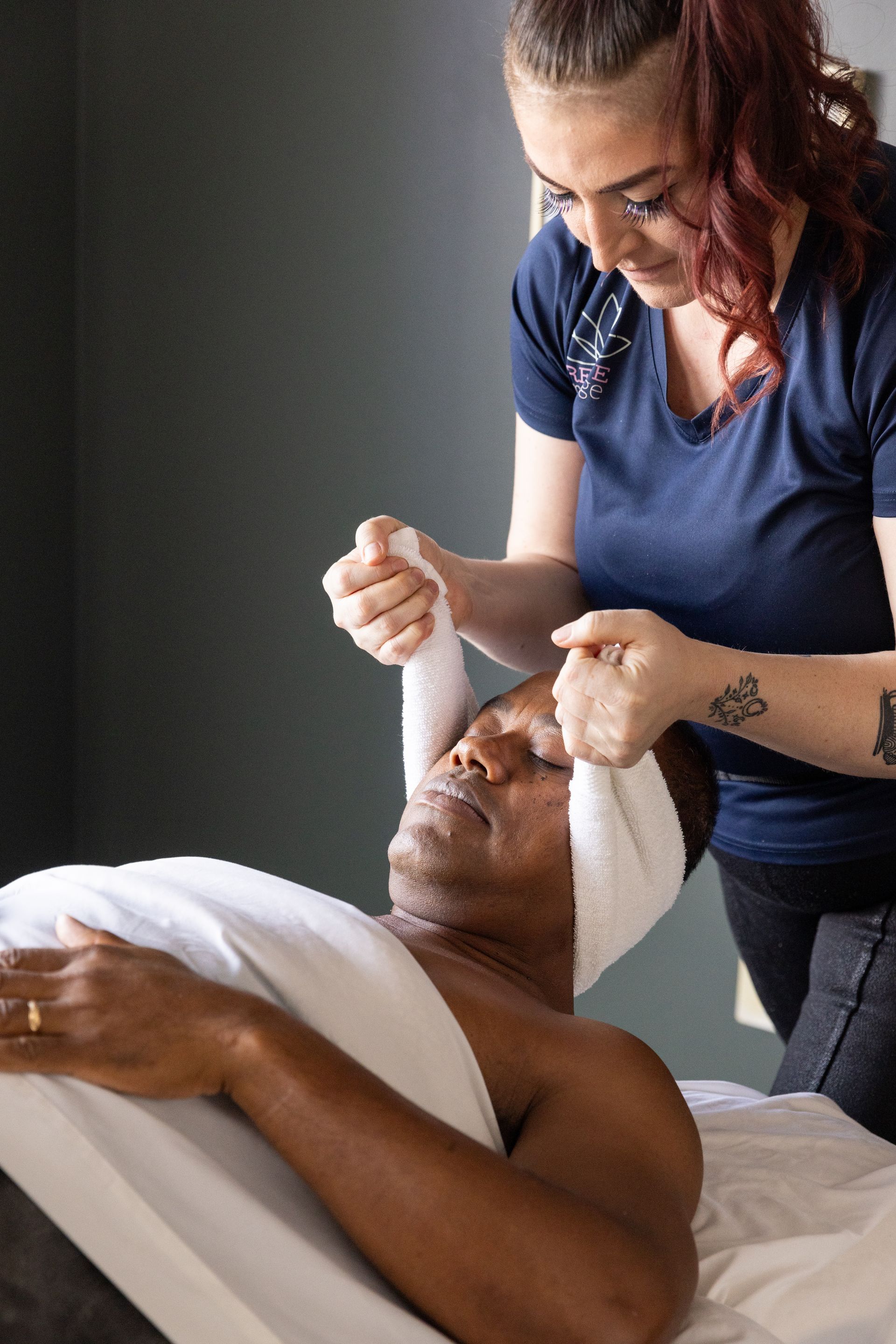 Therapist performing focused head and jaw work with a towel technique